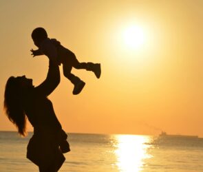 Photo by Pixabay: https://www.pexels.com/photo/silhouette-photo-of-a-mother-carrying-her-baby-at-beach-during-golden-hour-51953/