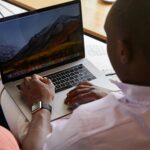Photo by Laker : https://www.pexels.com/photo/black-man-with-smart-watch-using-touchpad-of-laptop-5792851/