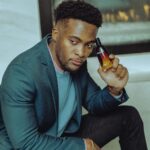 Photo by Ushindi Namegabe: https://www.pexels.com/photo/portrait-of-man-in-jacket-holding-bottle-of-perfume-10482351/