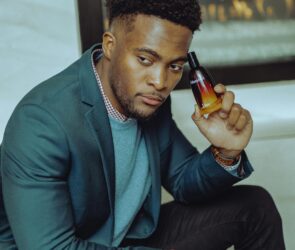 Photo by Ushindi Namegabe: https://www.pexels.com/photo/portrait-of-man-in-jacket-holding-bottle-of-perfume-10482351/