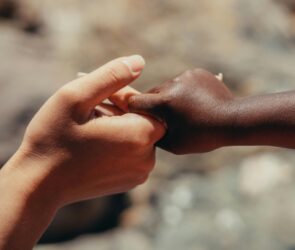Photo by Kindel Media: https://www.pexels.com/photo/close-up-photo-of-two-people-holding-each-other-s-hands-7978851/